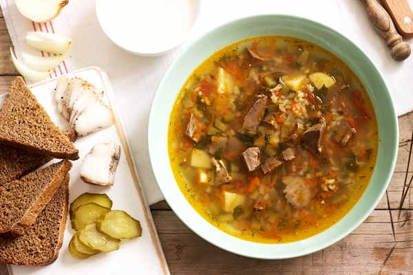 rassolnik traditional russian soup served with various snacks and vodka - Куриный рассольник