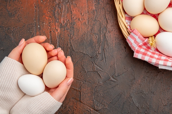 top view white chicken eggs inside basket with towel on dark table food animal farm breakfast color photo meal raw - Печёночные оладьи