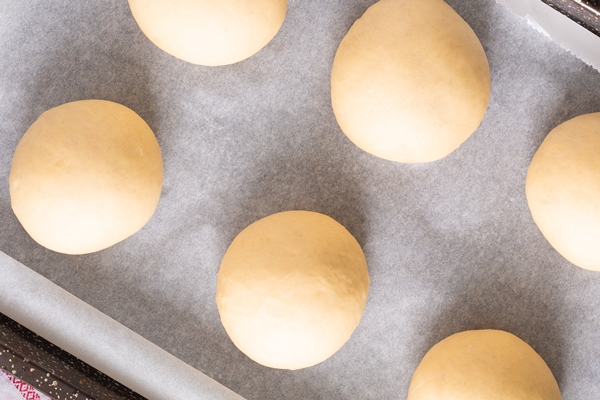 food concept proving proofing yeast dough of hamburger buns in bake pan before baking - Просфоры (рецепт № 4)