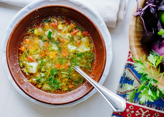 vegetable soup with herbs inside brown bowl - Тюря острая