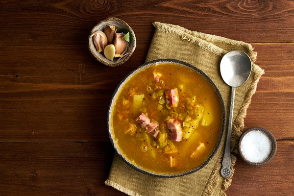 winter hot soup with chopped green peas pork bacon smoked on dark brown - Фронтовой гороховый суп