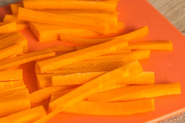 carrots cut into strips on a cutting board - Шурпа "Туристическая"