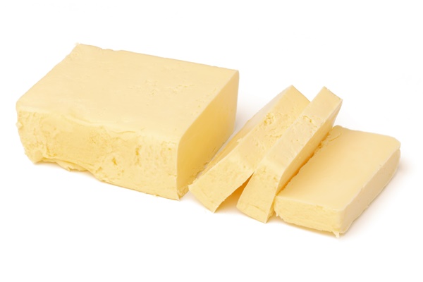 close up on block of butter isolated - Яичница по-походному