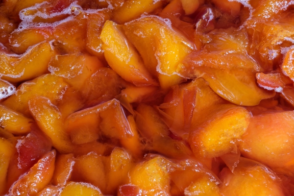 making jam from ripe juicy sweet peach fruits close up macro photography top view - Варенье из персиков