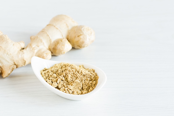 fresh ginger root and ground ginger spice on white wooden table background super foods - Сливово-имбирный джем