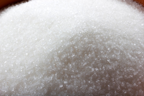 granulated sugar in bowl crystals of refined table sugar sweet soluble carbohydrates sucrose disaccharide of glucose and fructose - Постный маковый рулет с мёдом и изюмом