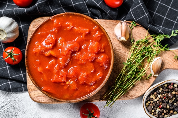 bowl of chopped tomatoes isolated on rustic white surface white background top view - Постный тыквенный суп "Копатыч"