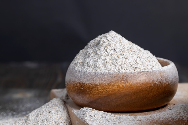 light rye flour with bran in a plate - Калитки карельские