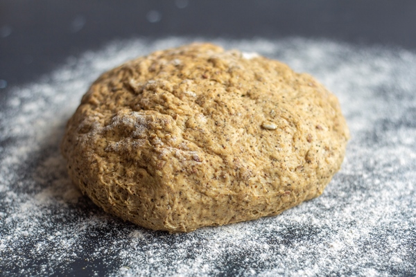 rye flour dough with various seeds and grains for baking grain bread - Калитки карельские