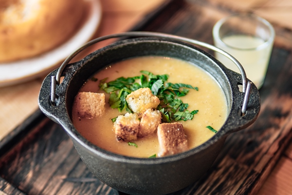 puree soup with croutons in old metal bowl - Королевский суп-пюре
