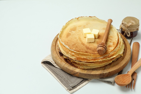 concept of tasty food with crepes on white background - Блинцы по-королевски