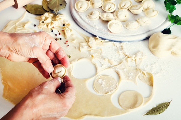 traditional russian pelmeni ravioli dumplings with meat - Пельмени