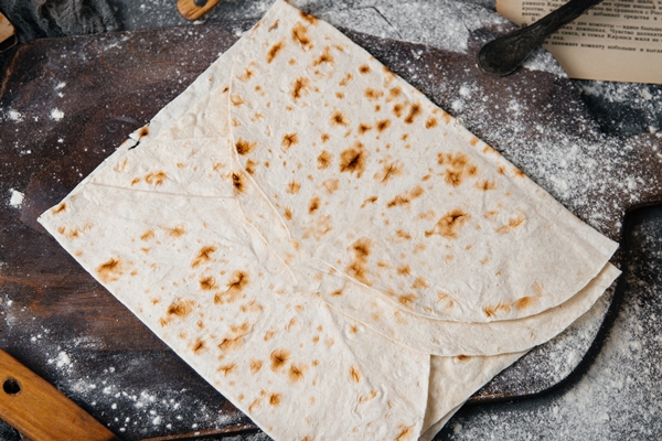 a top view lavash slices baked and tasty - Рулет из лаваша с баклажанами, чесноком и сливочным сыром