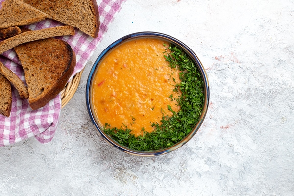 top view bean soup called merci with bread loafs on a white surface soup meal food vegetable bean - Библия о пище: чечевичная похлёбка Иакова