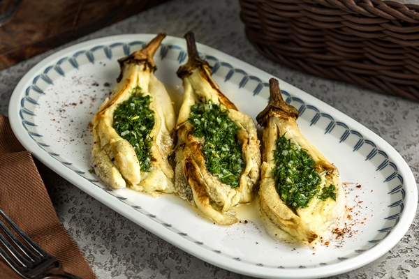 grilled eggplant with chopped herbs inside - Консервированный зелёный лук