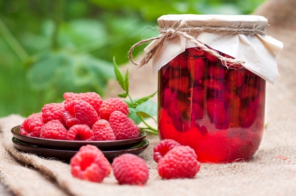 raspberry preserve glass jar fresh raspberries plate - Компот из малины на зиму