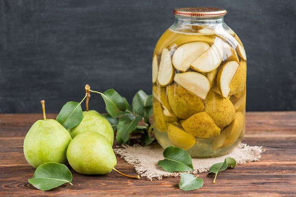 homemade pear compote fresh pears with leaves dark wooden background - Компот из груш