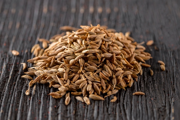 pile flavored caraway seeds spice dark wooden table - Анис