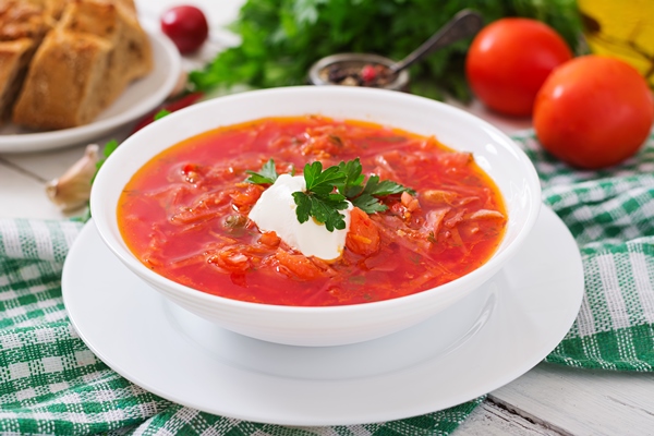 traditional ukrainian russian vegetable borscht white wooden surface - Борщ ялтинский со сливочным маслом