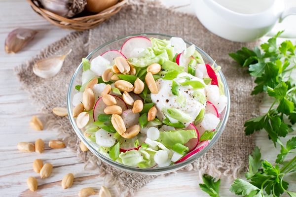 fresh salad with cabbage radish peanuts healthy vegan lunch bowl white wooden table top view - Салат из пекинской капусты с редисом и арахисом