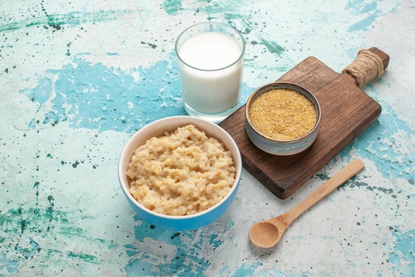 front view tasty porridge with milk blue desk breakfast meal food milk - Каша "Артек"