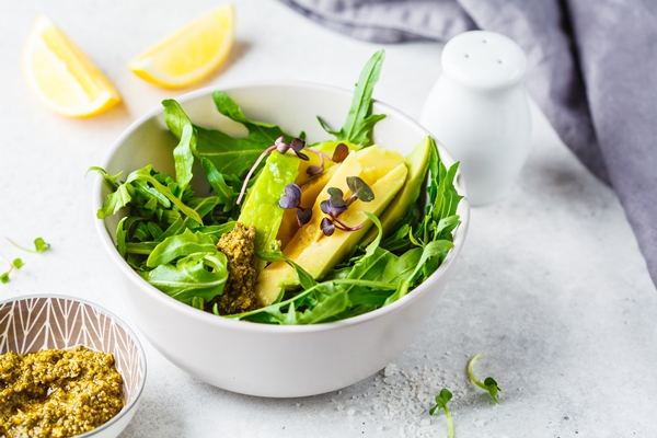 green avocado salad with arugula pesto gray bowl healthy vegan food concept 1 - Салат с авокадо