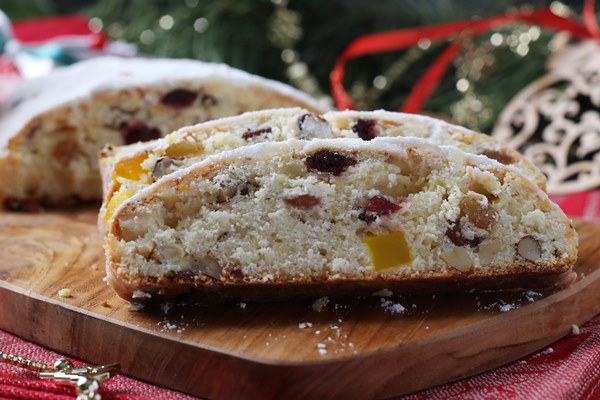 christmas tasty stollen with dry fruits berries nuts wooden board traditional german treats - Творожный штоллен