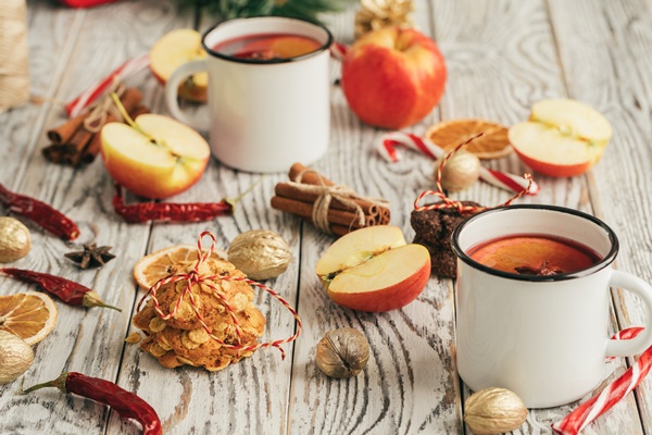 oatmeal cookies old wooden background with cinnamon sticks decorations - Горячий боярышниковый напиток