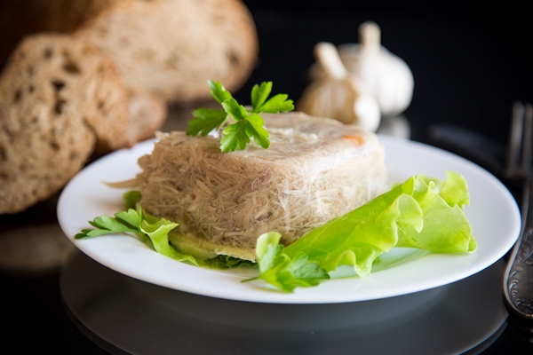 boiled chicken meat aspic meat gelatin broth plate - Холодец из поросёнка и петуха