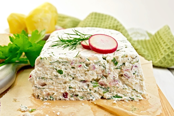 terrine curd radish with dill green onions paper board knife bread boiled potatoes napkin parsley light wooden planks - Творожный террин с редисом и травами