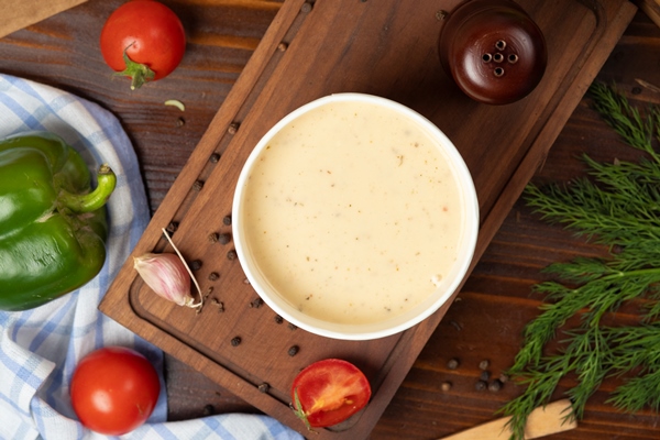 cream mushroom soup disposable cup bowl served with green vegetables - Салатный соус с тахини