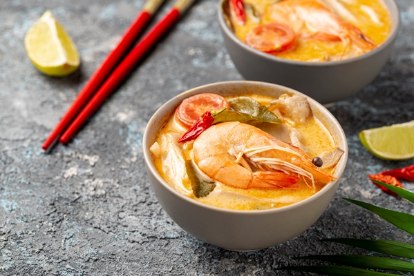 high angle soups bowls with shrimp chopsticks lemon - Том ям